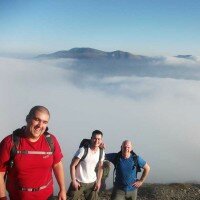 On the summit of Grisedale Pike with Skiddaw beyond