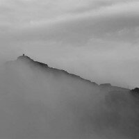 The summit of Snowdon appearing from the cloud