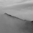 The summit of Snowdon emerging from the cloud